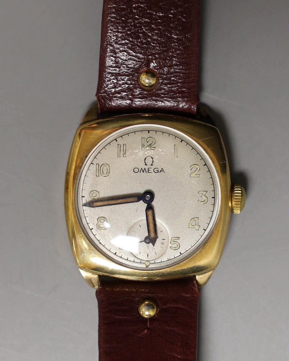 A gentleman's 9ct gold Omega cushion case wrist watch with silvered Arabic dial, monogrammed on the back and dated 1938